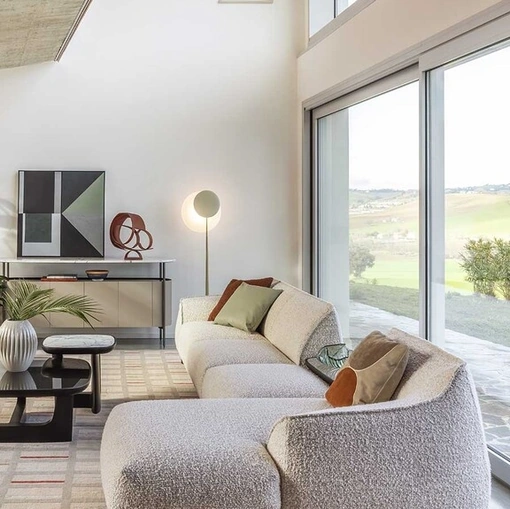 Divano Archibald Sofa System con penisola di Poltrona Frau
