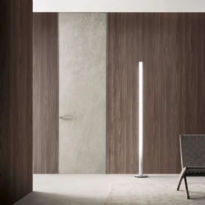 Porta a filo muro per interni Moon in finitura gres crema con struttura in alluminio finitura Platino di Rimadesio