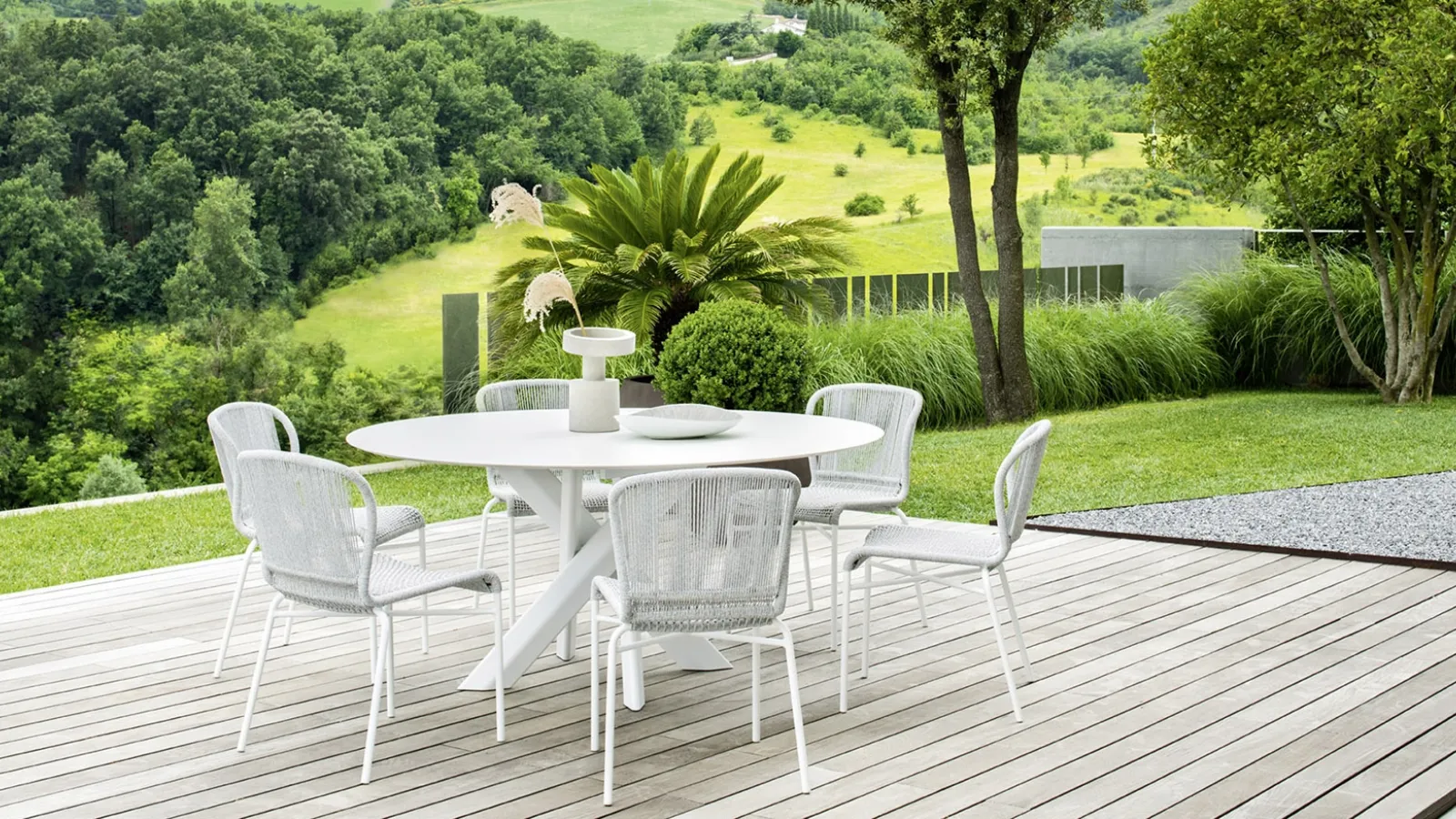 Tavolo rotondo System Star in alluminio con gambe intrecciate a stella di Varaschin